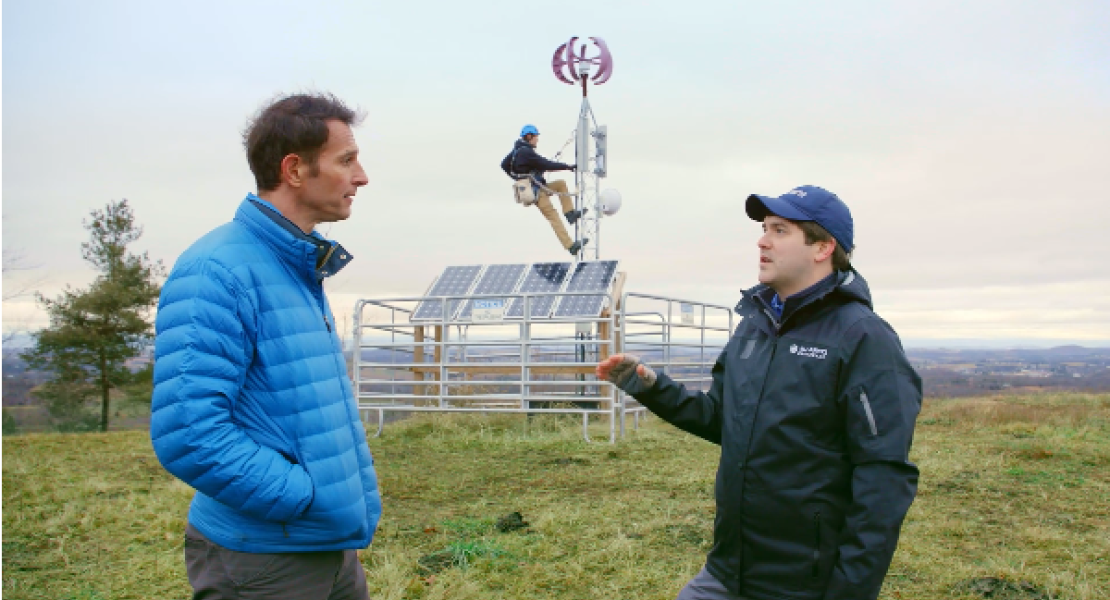 Two men talking in a field