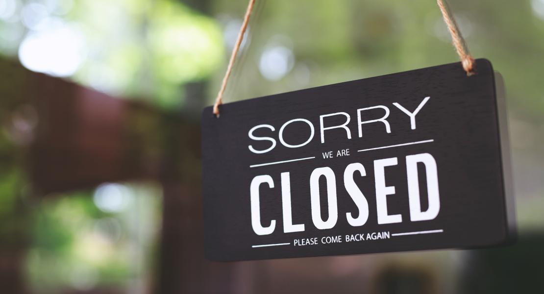 Sorry Closed sign hanging on door