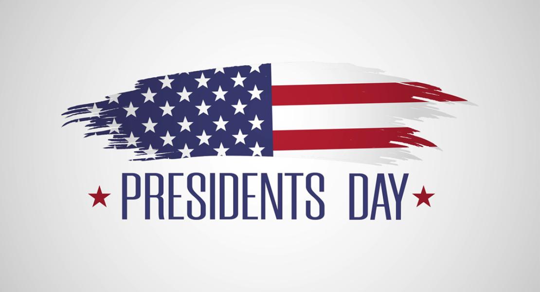 Sign with American flag that reads Presidents Day